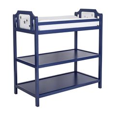 a blue wooden bunk bed with white mattresses on it's sides and bottom shelf