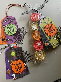 halloween treat bags with candy in them and tags attached to the top of each bag