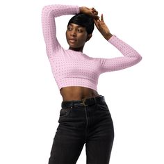 This long-sleeve crop top is made of recycled polyester and elastane, making it an eco-friendly choice for swimming, sports, or athleisure outfits. The crop top has a tear-away care label and a wide, double-layered waistline band for a comfortable fit. • Fabric composition in Europe: 88% recycled polyester, 12% elastane • Fabric weight in Europe: 6.78 oz/yd² (230 g/m²) • Fabric composition in Mexico: 81% REPREVE recycled polyester, 19% LYCRA® XTRA LIFE™ • Fabric weight in Mexico: 7.52 oz/yd² (255 g/m²) • UPF 50+ • Trendy, cropped fit • Wide, double-layered waistline band • Raglan sleeves • Tear-away care label • Size up if you’re between sizes as this fabric can be tight on the body • Blank product components in Europe sourced from Spain • Blank product components in Mexico sourced from Co Pink Fitted Long Sleeve Cropped Sweater, Athleisure Long Sleeve Crop Top For Spring, Fitted Long Sleeve Crop Top For Workout, Fitted Long Sleeve Crop Top In Athleisure Style, Fitted Long Sleeve Crop Top Athleisure, Fitted Long Sleeve Crop Top For Athleisure, Trendy Long Sleeve Workout Crop Top, Elastane Fabric, Athleisure Outfits