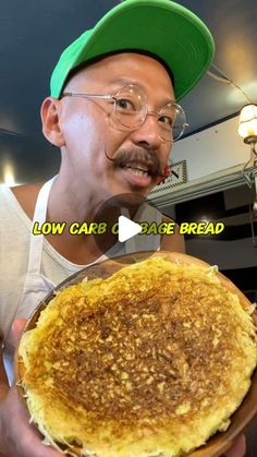 a man holding a plate with food on it and the caption low carb, take bread