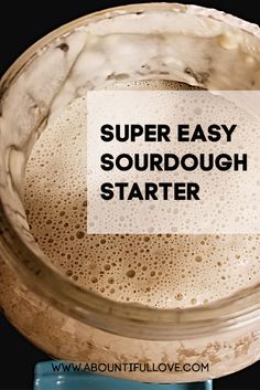 a glass jar filled with liquid and the words super easy sourdough starter on it