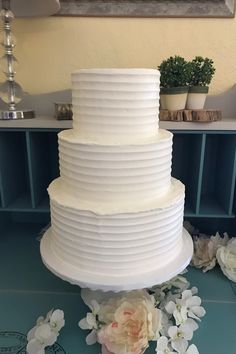 a large white cake sitting on top of a table