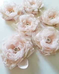 several pink flowers with pearls on them