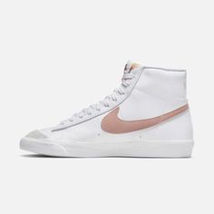 Style No. CZ1055-118 Color: White/Peach/Summit White/Pink Oxford Styled for the '70s. Loved in the '80s. Classic in the '90s. Ready for the future. The Nike Blazer Mid '77 delivers a timeless design that's easy to wear. Its unbelievably crisp leather upper gets broken in beautifully, and is paired with bold retro branding and luscious suede accents for a premium feel. Nike Blazer Mid '77 Women's Shoes Nike Blazer Mid 77 Women, Nike Rosa, Nike Blazer Mid 77 White, Blazer Shoes, Blazer 77, Blazer Mid 77 Vintage, Gymnastics Shoes, Stefan Janoski, Nike Blazer Mid 77