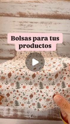 a person holding a bag with the words bolsas para tus productos on it