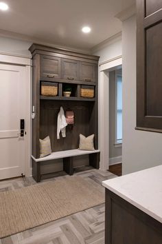 a mud room with an entryway and storage area