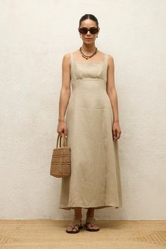 DescriptionThe Elise Linen Sleeveless Midi Dress in Beige is the perfect blend of elegance and comfort. Designed for the modern woman, this dress features a minimalist silhouette that flatters every figure. The dress is crafted from high-quality linen, ensuring breathability and a lightweight feel, making it ideal for warm weather. The square neckline and wide shoulder straps provide a classic look, while the front slit adds a touch of sophistication and ease of movement. Features • Material: Premium linen blend for a soft and breathable feel • Design: Sleeveless with a square neckline and front slit • Fit: Tailored fit that enhances the silhouette • Length: Midi length, falls to mid-calf • Color: Beige, a versatile and timeless shade • Occasions: Suitable for casual outings, beachwear, an Linen Fashion, Simple Summer, Black Prom Dress, Sleeveless Midi Dress, Maxi Dress Cocktail, Linen Tunic, Midi Dress Sleeveless, White Outfits, New Arrival Dress