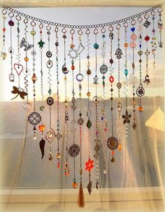 a window with many different colored beads hanging from it