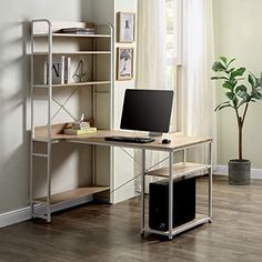 a laptop computer sitting on top of a wooden desk in front of a book shelf