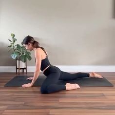 a woman in black top and leggings doing yoga