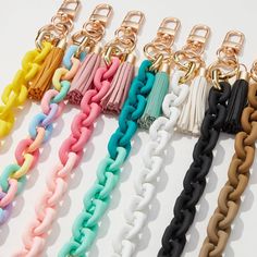 Introducing our Silicone Coated Matte Key Ring Bracelets with Leather Tassel. Made with high-quality silicone, these bracelets provide a comfortable and secure grip for your keys. The sleek matte finish adds a touch of style, while the leather tassel adds a unique flair. Keep your keys within reach and look fashionable doing it. Approx. 7 1/2" Length Black Flare, Oversized Cardigan, Scarf Jewelry, Pink Bracelet, Leather Tassel, Embroidered Sweatshirts, Jogger Sweatpants, Bottom Clothes, Clothes Collection