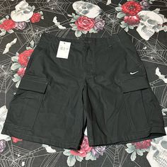 New With Tags Nike Sb Kearny Men’s Black/White Cargo Skate Shorts Mens Size 24 (Large). Retail: $80.00 Nike Sb Kearny Cargo Shorts. Made From Durable Ripstop Fabric, The Nike Sb Cargo Shorts Are Built To Last. The Classic Cargo Design Doesn't Skimp On Storagewith 6 Pockets You'll Have Plenty Of Places To Keep Your Essentials Secure While You Skate. Cargo Pockets On Both Sides And Back Flap-Over Pockets Give You Secure Space To Stash Your Stuff So You Can Cruise Hands-Free. Nike Embroidered Logo Nike Cargo Shorts For Streetwear, Black Cargo Shorts With Pockets For Sports, Black Cargo Shorts With Side Pockets For Sports, Sporty Black Cargo Shorts, Sporty Short Cargo Pants For Sports, Nike Streetwear Shorts With Pockets, Nike Black Cargo Pants For Outdoor, Nike Black Bottoms For Outdoor Activities, Black Nike Cargo Pants With Side Pockets