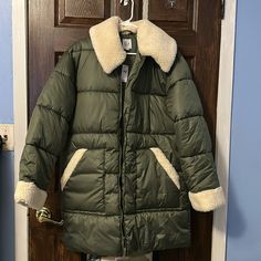 Never Worn, Brand New With Tag Not Removed. With Sherpa On Collar And Sleeves Green Long-sleeve Puffer Jacket With Pockets, Green Puffer Jacket With Double-lined Hood For Outdoor, Khaki Long-sleeved Parka With Multiple Pockets, Sporty Long-sleeve Puffer Parka, Long Puffer Coat, Quilted Nylon Long-sleeved Parka, Gap Jacket, Puffer Coat, Puffer