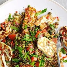 a white plate topped with meat and veggies