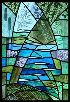 a stained glass window with plants and water