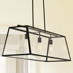 three light fixtures hanging from a ceiling fixture