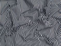 the black and white striped fabric is very close to it's surface, as well as stripes