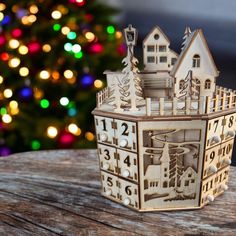 It is just breathtaking. This laser cut advent calendar is cut from 3mm basswood and assembled into a beautiful village on top of working drawers to fill with goodies for the Christmas countdown. Each day has its own drawer the can be filled with goodies and candy for that special someone. The advent calendar measures  8 1/2 inches wide x 12 inches tall x 7 inches deep. Each drawer measures 1 1/2 inches x 1 1.4 inches x 1 1/2 inches deep. It would make a great addition and heirloom for your family. Something that can be passed down through out the years to carry out the family traditions. Wooden House Advent Calendar, Advent Ideas, Christmas Advent Calendar, Beautiful Villages, Christmas Advent, Christmas Countdown, Family Traditions, Wedding Basket, Each Day