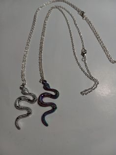 snake necklace, silver snake or multicolor snake on silver chain, animal lovers and snake lovers will adore. Metal Snake Chain Necklace For Gift, Trendy Snake-shaped Metal Jewelry, Snake-shaped Metal Necklace With Adjustable Chain, Silver Snake Necklace For Party, Sterling Silver Snake-shaped Jewelry For Parties, Silver Snake Chain Necklace With Adjustable Chain, Sterling Silver Snake Shape Jewelry For Party, Trendy Snake Shape Chain Necklace With Adjustable Chain, Trendy Adjustable Snake Shape Chain Necklace