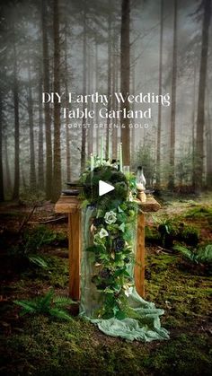 an image of a table with candles and flowers on it, surrounded by greenery