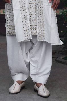 Ivory kurta with sequin, thread and mirror embroidery. Paired with an ivory salwar and embroidered dupatta. - Aza Fashions White Semi-stitched Sherwani With Mirror Work, White Chanderi Sherwani With Mirror Work, White Ceremonial Dupatta With Dabka Work, Ceremonial White Dupatta With Dabka Work, Off White Traditional Wear With Mirror Work, Cotton Sherwani With Mirror Work And Traditional Drape, Traditional Cotton Sherwani With Mirror Work, Cotton Sherwani With Mirror Work, Cotton Sherwani With Gota Work For Wedding