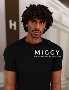 a man with curly hair wearing a black t - shirt that says micgy on it