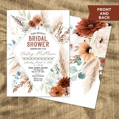 the floral bridal shower card is shown on top of a wooden table with flowers and leaves