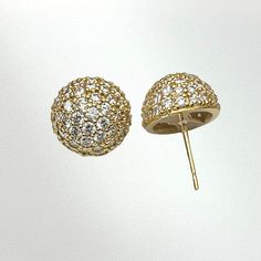 Cast in 18k yellow gold. These look dainty but pack a lot of bling! These studs are a convex dome shape to maximize the surface area for the diamonds. The pair of studs features over 100 x 1.5mm white diamonds weighing it at a total of 1.5 carats. The diamonds are set in a traditional bead-set pattern known as pavé. Each pavé dome stud measures .45 inches on the ear. - 18K yellow gold - 1.5mm white diamonds - 1.52ctw F-G color VS clarity -.45 Inches - extra large earring backs Available in 18k w Gold Round Cut Single Cut Diamond Earrings, Gold Single Cut Round Diamond Earrings, Luxury Gold Cluster Earrings With Diamond Accents, Luxury Yellow Gold Cluster Earrings, Dazzling Gold Brilliant Cut Diamond Earrings, Yellow Gold Round Earrings With Diamond Accents, Luxury Gold Round Diamond Earrings, Luxury Round Cluster Earrings For Pierced Ears, Luxury Round Earrings With Sparkling Stones