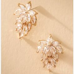 New~ Anthropologie Gold Crystal Cluster Post Earrings "These Delicate Crystal Cluster Post Earrings Exude Feminine Grace With Their Understated Elegance." Elegant And Classy, These Petite Floral Crystal Earrings Are Stunning! Aaa Quality Cubic Zirconia Sparkles At Every Turn. Lightweight And Easy To Wear All Day/Night Long. Perfect For Everyday Or Formal Occasions. 3/4”L, 1/2”W. Gold-Plated Brass, Cubic Zirconia, Post Backs Included. Nwot. *Also Available In Silver, See My Other Listing And Last Statement Earrings Formal, Pin Up Party, Red Carpet Wedding, Gold Statement Earrings, Anthropologie Jewelry, Gold Crystal, Cluster Earrings, Day Night, Understated Elegance