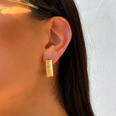 Introducing Maiori Textured Hoops - the perfect addition to your everyday wardrobe. With a stylish ribbed design & European influences, these hoops bring a touch of beach vibes to any outfit. Upgrade your look with the must-have Maiori Textured Hoops. Product Details: 25mm 24k Gold-Filled Textured Hoops Butterfly Clasp with Rubber Surrounding Water-Wearable Made in Scottsdale, AZ Trendy Gold Hoop Earrings For Vacation, Casual Hoop Earrings For Beach, Casual Hoop Earrings For The Beach, Casual Summer Hoop Earrings, Chic Hoop Earrings For Summer Beach, Chic Hoop Earrings For Beach In Summer, Trendy Hoop Earrings For Vacation, Trendy Hoop Earrings For Beach In Spring, Trendy Hoop Earrings For Spring Beach Events