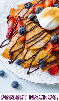 dessert nachos with fruit and chocolate drizzled on top