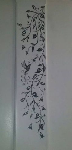 the wall is decorated with black and white designs