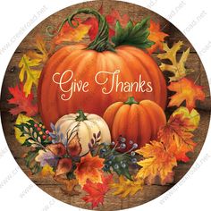 a wooden sign with pumpkins and leaves on it that says give thanks to all of us