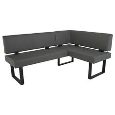 a gray couch sitting on top of a metal frame