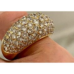 A true statement ring: 18 karat yellow gold dome cocktail ring, embellished with 3.5 carats of colorful, sparkly pavé set VS1 diamonds. Hallmarked with jeweler's mark in cartouche but is illegible. Size US 6. Made in France, circa mid to late 20th century. Luxury Diamond Dome Ring With Vs Clarity, Luxury Dome Diamond Ring With Vs Clarity, Formal Dome Ring With Pave Setting, Luxury Yellow Gold Dome Ring With Pave Setting, Gold Dome Ring With Vs Clarity Diamond, Gold Dome Ring With Pave Diamond Setting, Fine Jewelry Gold Dome Ring With Pave Setting, Formal Round Dome Ring With Pave Setting, Gold Dome Ring With Pave Setting