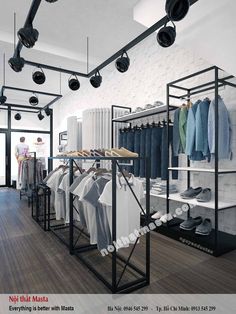 the inside of a clothing store with clothes on racks