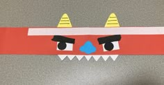 a paper mask made to look like a monster