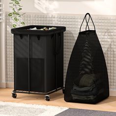 a black laundry hamper next to a trash can