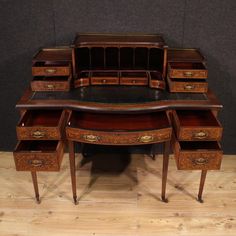 an antique desk with two drawers on each side