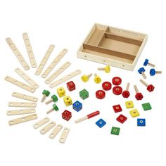 wooden blocks and pegs in a box on a white background