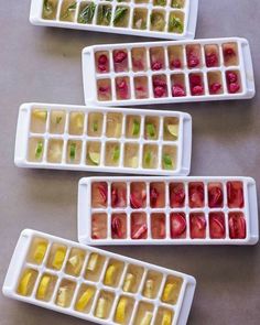 four trays filled with different types of fruit