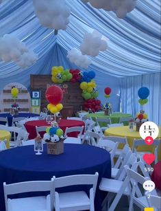 an image of a party setting with balloons and decorations on the ceiling, table cloths and chairs