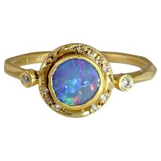 Bluish Purple, 0.60ct Round Australian Boulder Opal, Stackable Ring with Diamond Detail, 24K Solid, Yellow Gold. One of a Kind Ring. This piece would make a great stacker ring.   Details: Diamonds: 0.05ct (12 Diamonds) Opal: 0.60ct. Size: 6 1/2 (US) About Opal: In ancient times, this stone was believed to possess all the characteristics of all gemstones and is used because it represents hope, clarity, and truth. Queen Victoria is thought to have gifted her five daughters' opal jewelry at their w Mexican Opal Ring, Unique Mens Rings, Boulder Opal Ring, Bluish Purple, Stackable Diamond Rings, Big Jewelry, Platinum Diamond Rings, Alexandrite Ring, Australian Boulder Opal