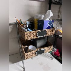 two wicker baskets with chalkboard labels on them