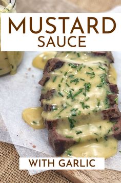 the steak is covered in sauce and garnished with parsley on top, next to a jar of mustard