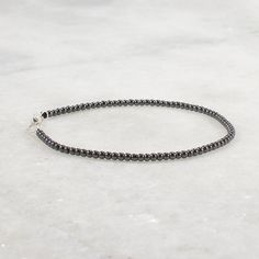 This delicate hematite bracelet is accented with sterling silver beads. The beads are tiny 2mm hematite beads. The clasp is a secure lobster claw. This minimalist bracelet can be worn alone or layered with your other gemstone bracelets. This dainty bracelet is made of 2mm beads, see pictures to see the scale of the beads. Ultra Skinny Bracelet 2mm round hematite beads lobster claw clasp and oversized ring for easy clasping strung on cord for durability and a soft drape Choose your bracelet lengt Minimalist Hematite Round Bead Jewelry, Minimalist Single Strand Beaded Bracelets, Minimalist Silver Beaded Bracelet With Black Beads, Elegant Hematite Beaded Bracelets With Silver Beads, Silver Minimalist Hematite Jewelry, Minimalist Silver Hematite Jewelry, Silver Hematite Beaded Bracelets With Black Beads, Gift Bracelet With Silver Beads And Hematite, Oversized Ring