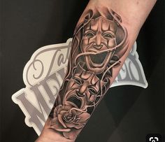 a person with a tattoo on their arm that has an image of a man's face