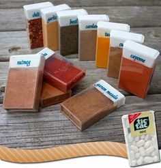 there are many different types of spices on the wooden table, including ground and salt