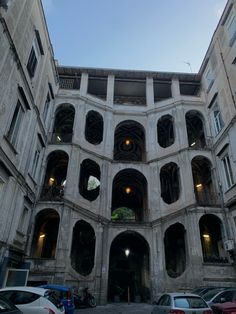 an old building with multiple stories and arches