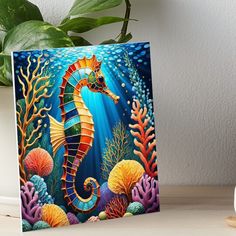 a painting of a sea horse on a blue background art boarder next to a potted plant